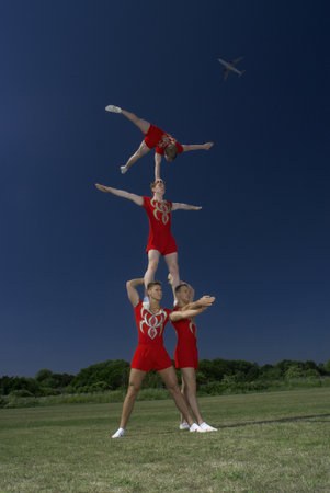 Acrobatic troop performing movesの写真素材