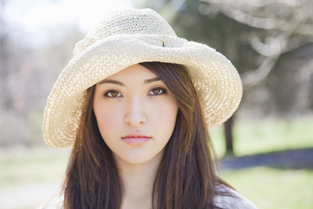 Portrait of a girl wearing a hatの写真素材