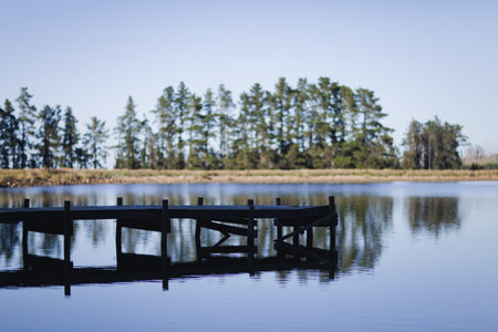 Jetty over rural lakeの写真素材
