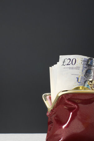 Purse with pound notes in itの写真素材