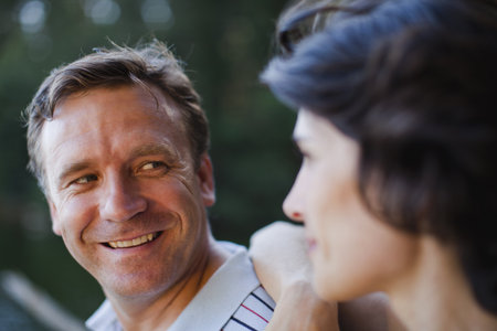 Smiling couple talking outdoorsの写真素材