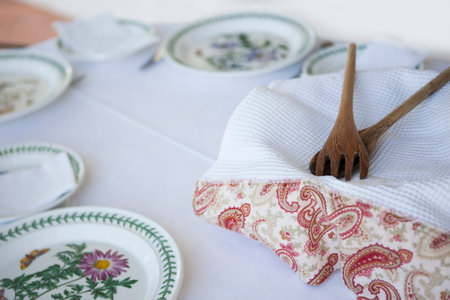 Serving spoons with towel and platesの写真素材