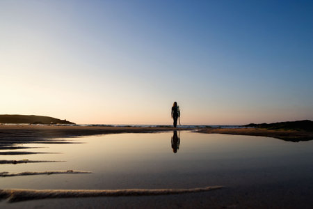 Woman standing on the beachの写真素材