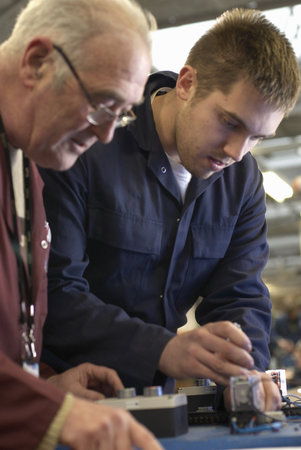 Electrical engineers working in shop
