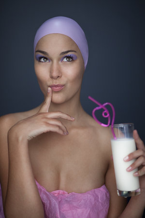 Woman drinking with curly strawの写真素材