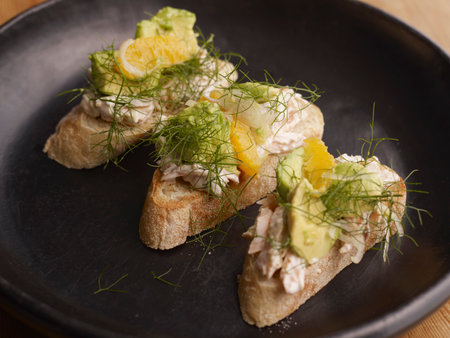 Smoked trout toasts with relishの写真素材