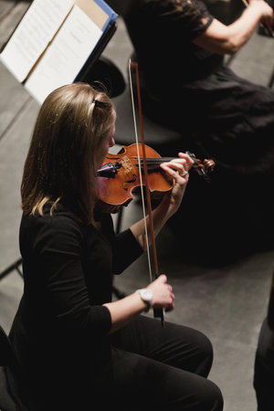 Violin player in orchestraの写真素材