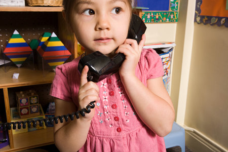 A girl using a telephoneの写真素材