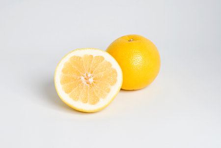 Whole and half grapefruitの写真素材