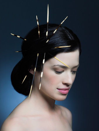 Young woman with porcupine quills in hairの写真素材