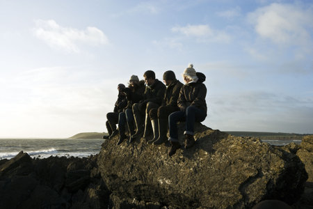 Group of Friends sitting on rock