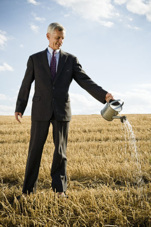 Businessman in a wheat field.の写真素材