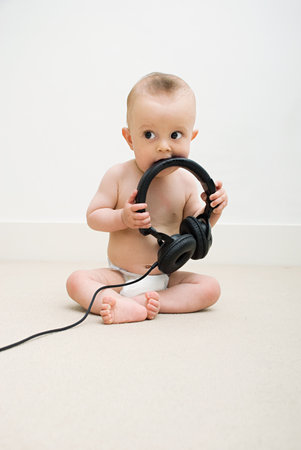 Baby with head phonesの写真素材