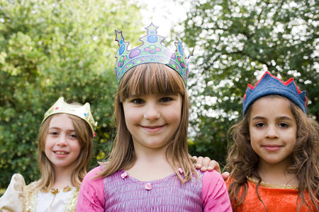 Girls wearing crown dressed up as queensの写真素材