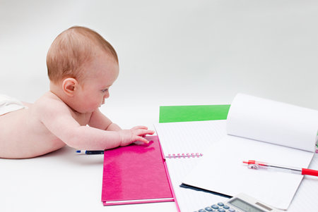 Baby with notebooksの写真素材