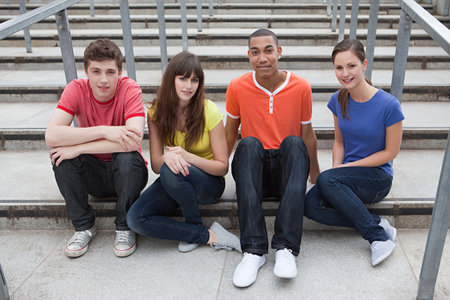 Young people sitting on steps