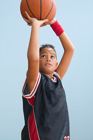 Boy about to throw basketball