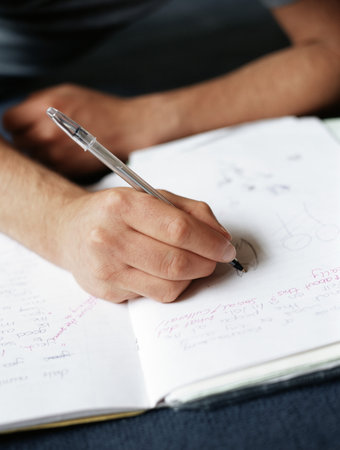 Teenage boy doing homeworkの写真素材