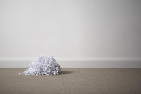 A pile of shredded paper on the floor.の写真素材