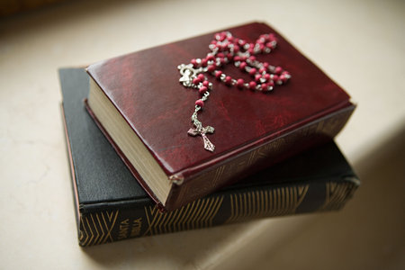 Rosary on bibles