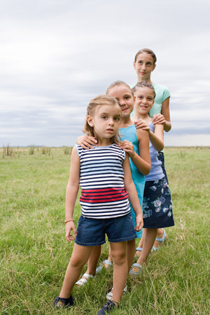 Girls standing in a rowの写真素材