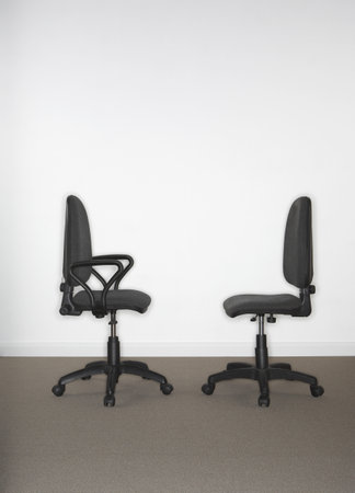 Two office chairs facing each other.の写真素材