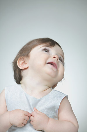 Baby girl looking upの写真素材