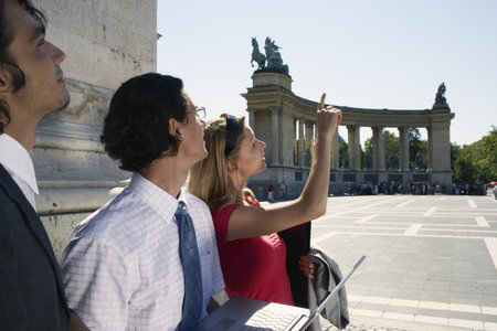 Three businesspeople looking at laptop.の写真素材
