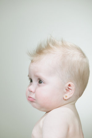 Baby girl with spiked hairの写真素材