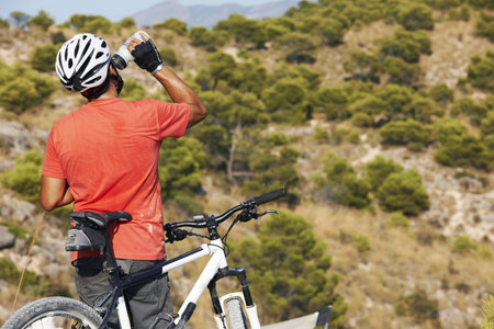 A man mountain biking aloneの写真素材