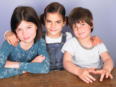 Children at their desk, smilingの写真素材