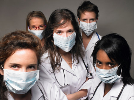 Group of young doctors wearing masksの写真素材