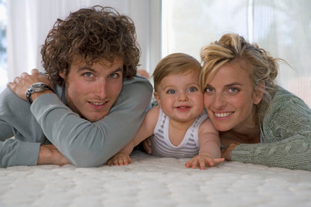 Portrait happy parents with babyの写真素材