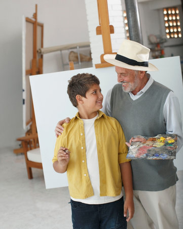 Grandfather and grandson paintingの写真素材