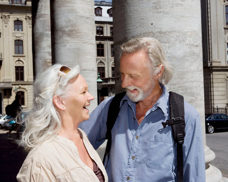 Couple standing laughingの写真素材
