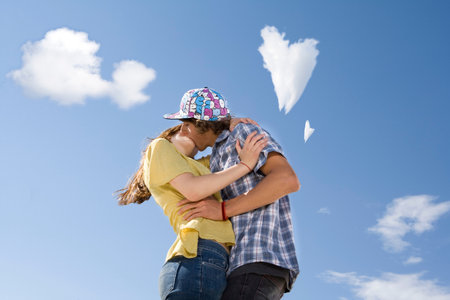 Teen couple kissingの写真素材