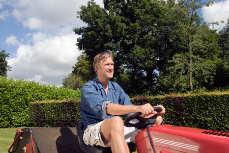 Man mowing a lawnの写真素材