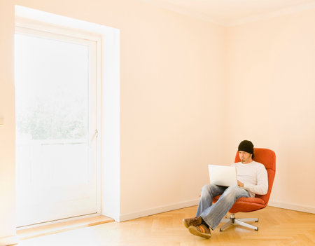Man working on a laptop computerの写真素材