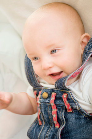 A baby relaxed and smiling.の写真素材
