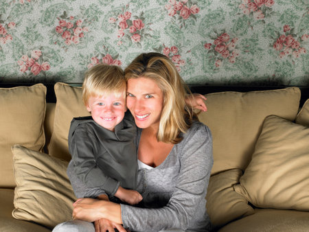 mother and son watching televisionの写真素材