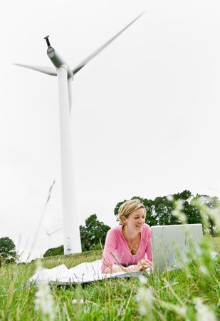 Woman working on a laptop computerの写真素材