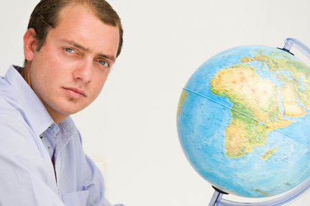 Portrait of a male and a globeの写真素材