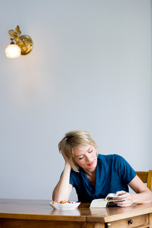 Woman reading a bookの写真素材