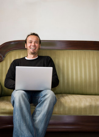 Man working on a laptop computerの写真素材