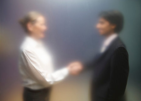 Man and woman shaking handsの写真素材