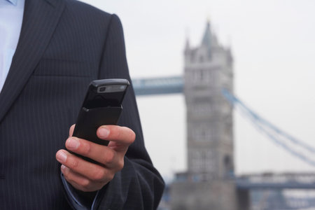 Business man using a mobile phoneの写真素材