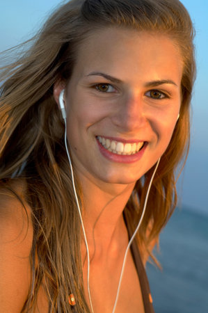 Young woman at the beachの写真素材