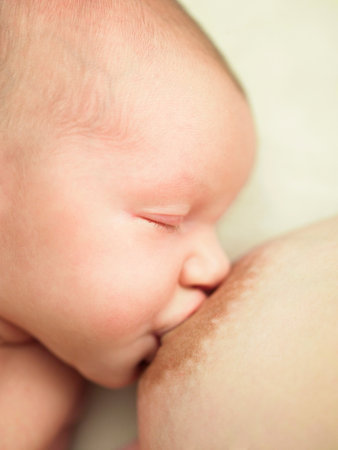 Baby feeding on breastの写真素材