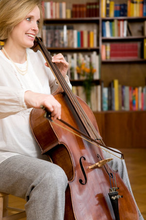 pregnant woman playing Celloの写真素材