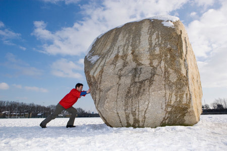 Man pushing boulderの写真素材
